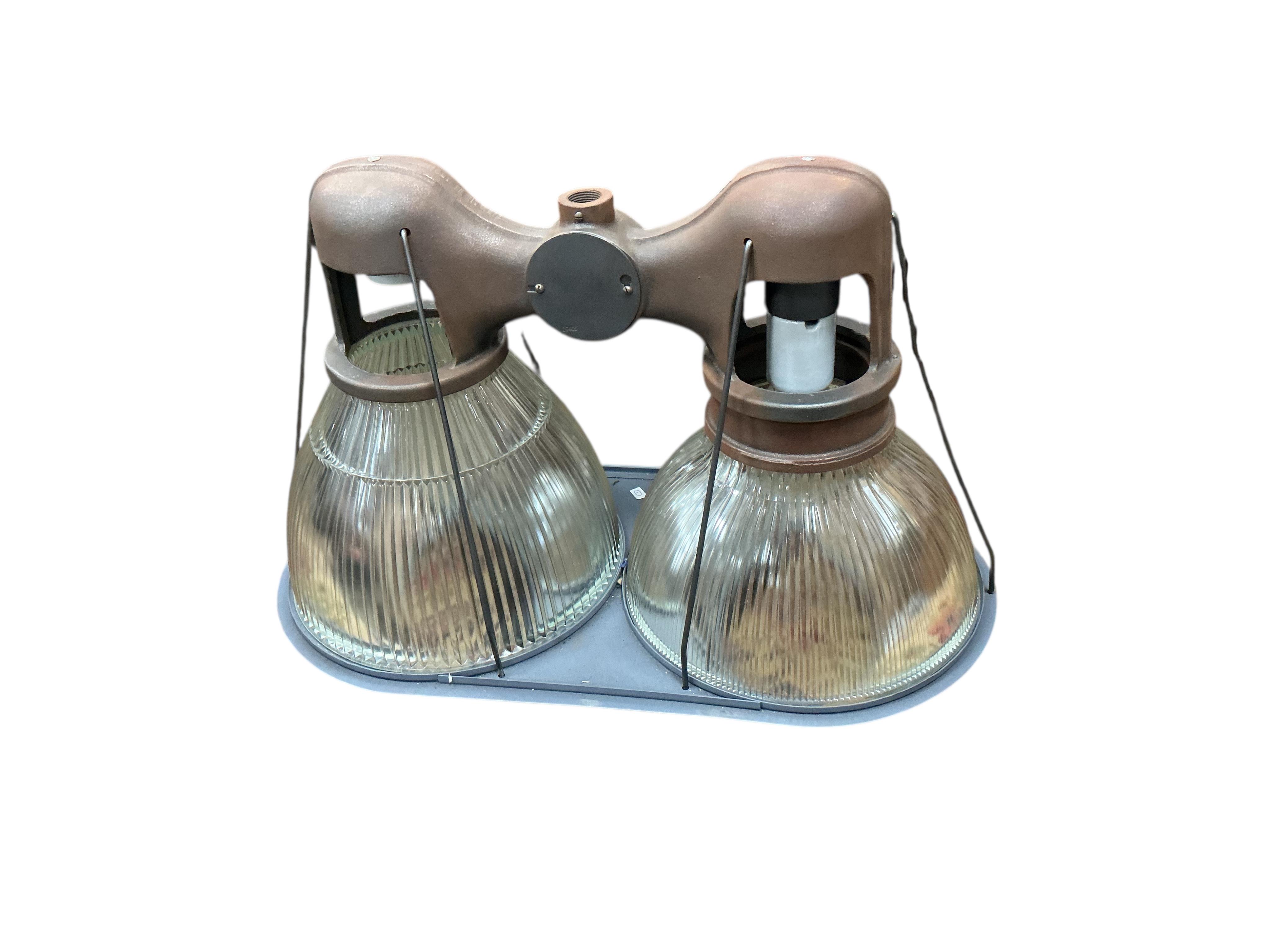 A pair of Holophane double industrial factory lights, width 64cm, height 42cm